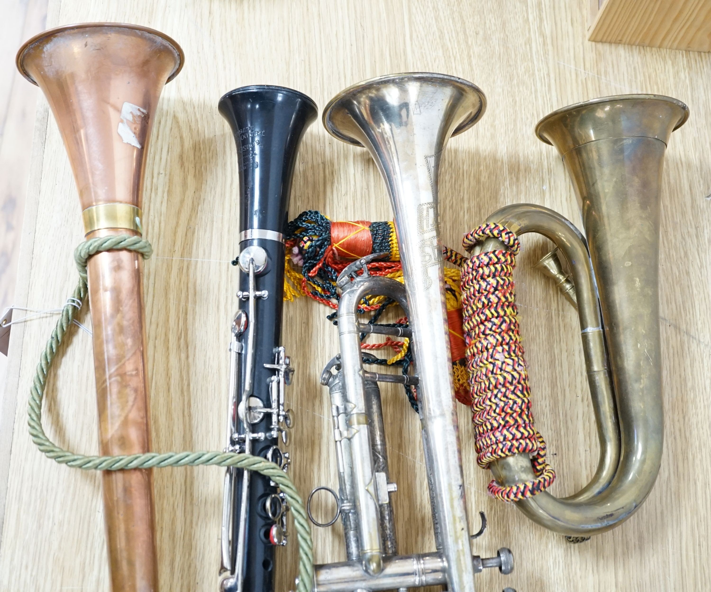 A Boosey and co Clarinet H.75983, plated trumpet, brass bugle and a copper hunting horn 87cm